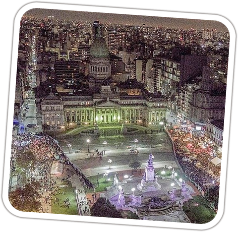 Night aerial view of the crowd outside Argentina's Congress, lit green, Buenos Aires, June 2018